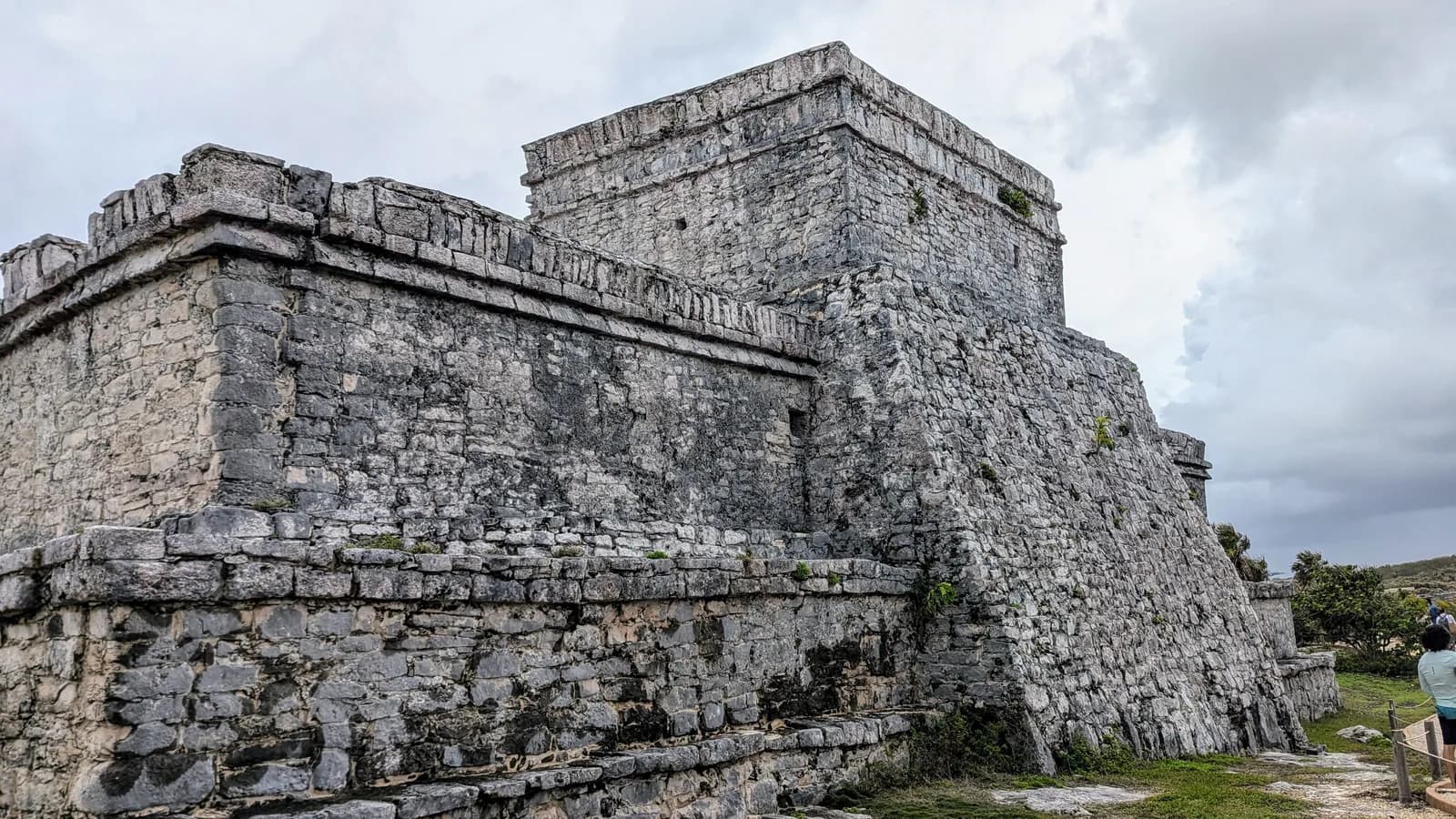 El Castillo pyramid at the Tulum archaeological site under a blue sky, Quintana Roo, Mexico