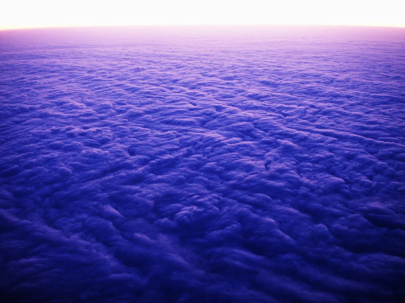 Sunrise breaking over a sea of clouds seen from the summit of Mount Emei
