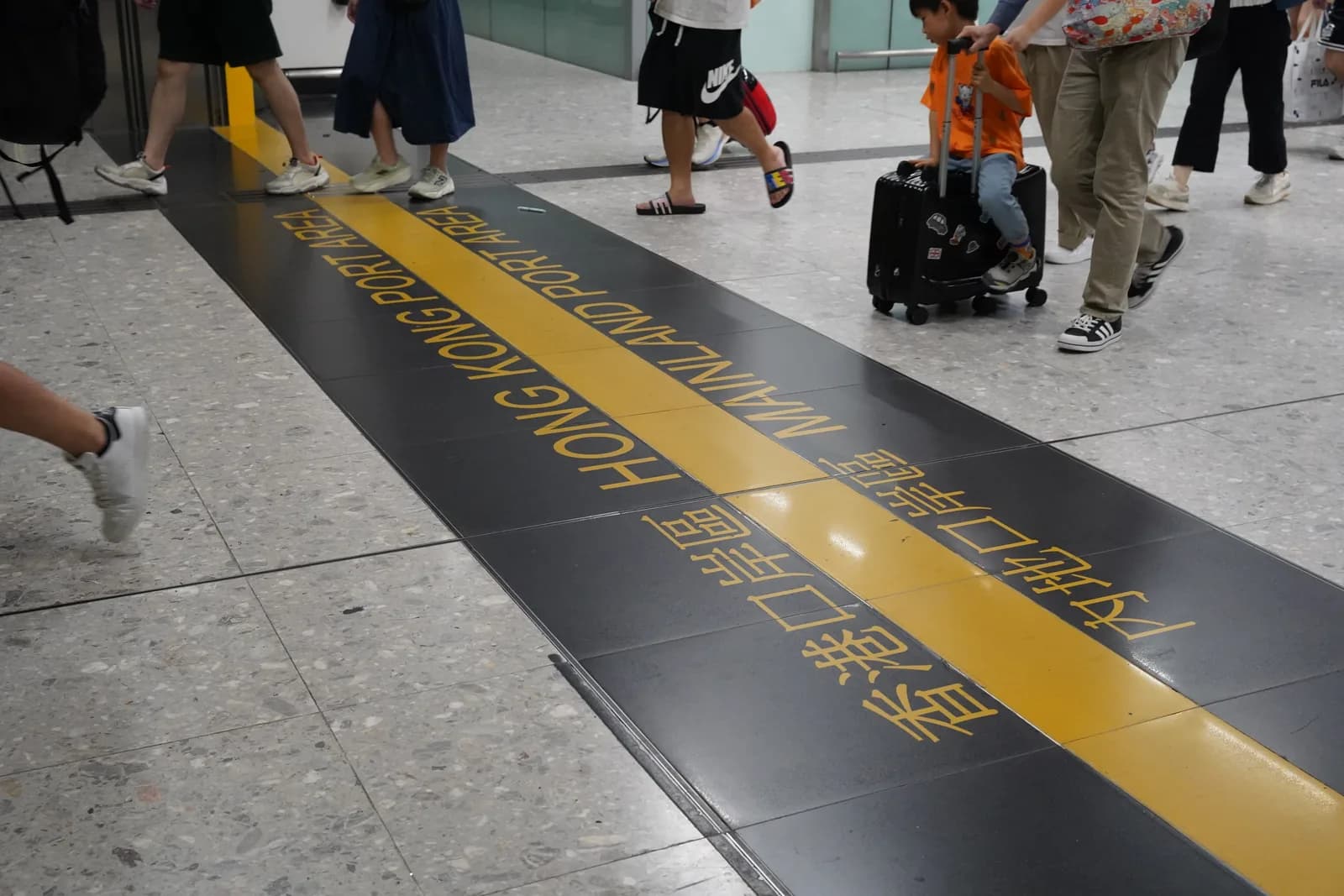 The floor marking of the Hong Kong and mainland China boundary inside Hong Kong West Kowloon high-speed rail station