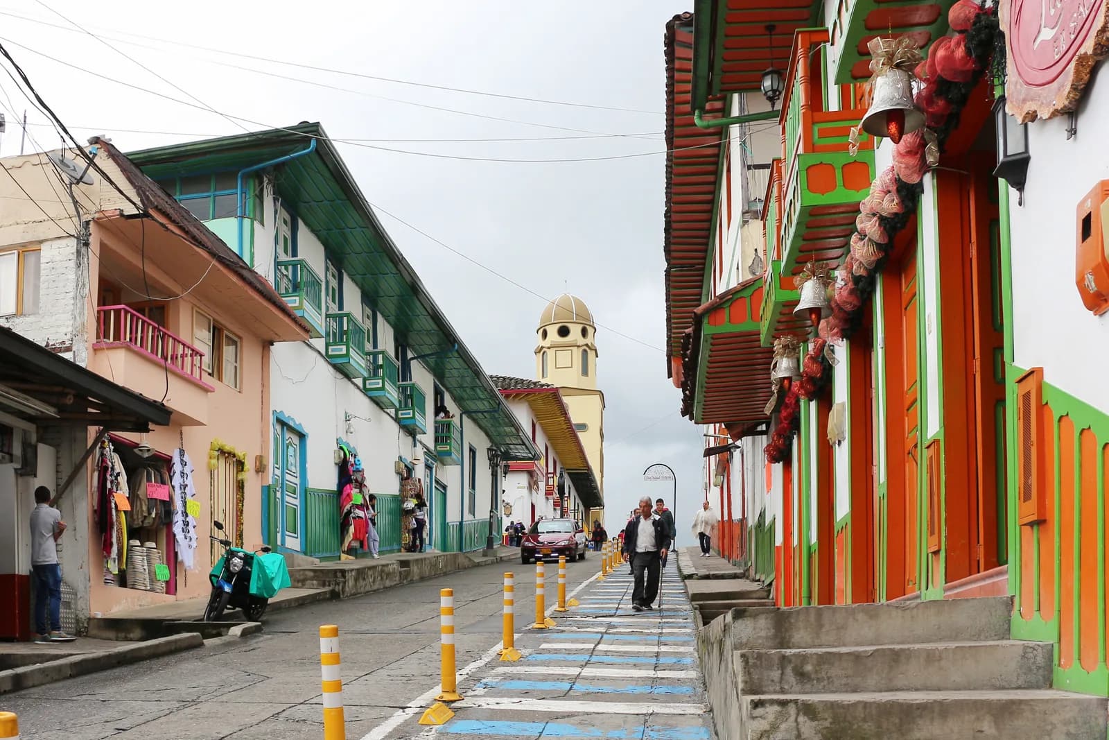 Colorful shopfronts and painted balconies along Calle 5, the main street of Salento, Colombia