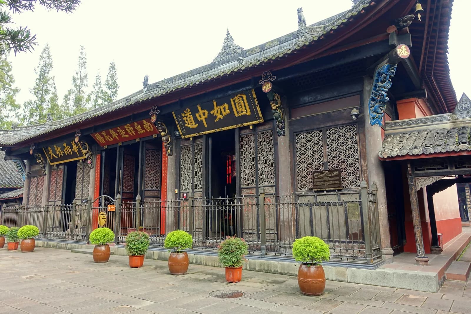 Timber prayer hall with sweeping tiled eaves at Wenshu Monastery in central Chengdu