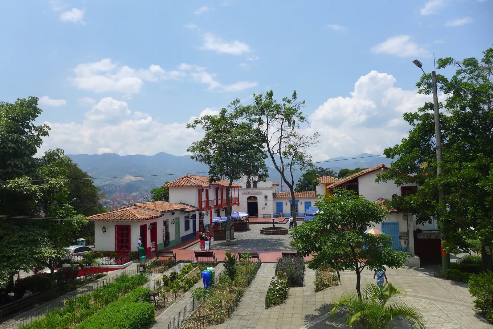 The church and flower-decked plaza of Pueblito Paisa, the replica village on Cerro Nutibara in Medellín