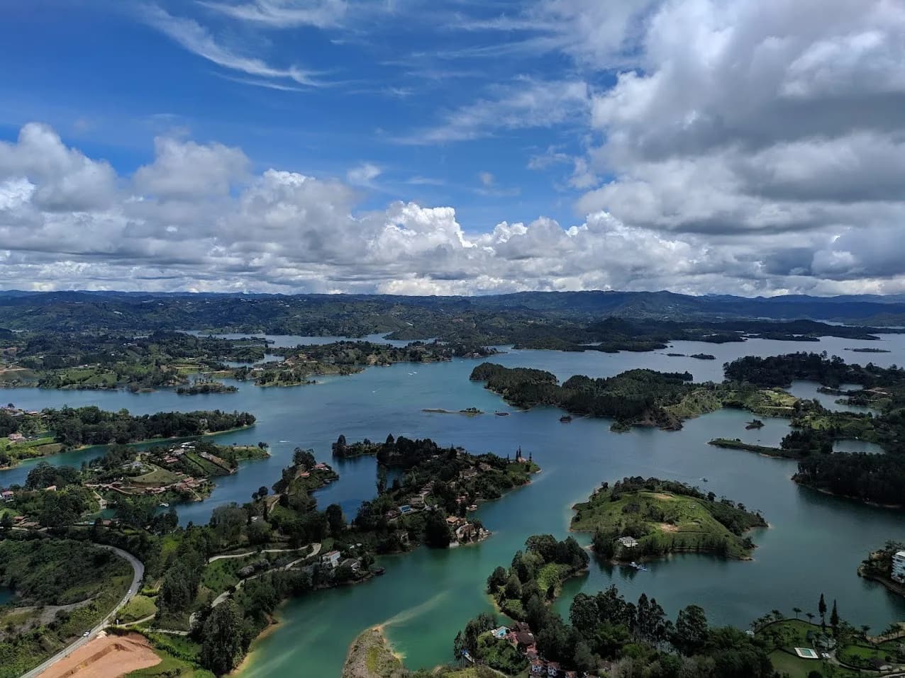 Colorful painted houses and church of Guatapé town beside the reservoir, Antioquia, Colombia