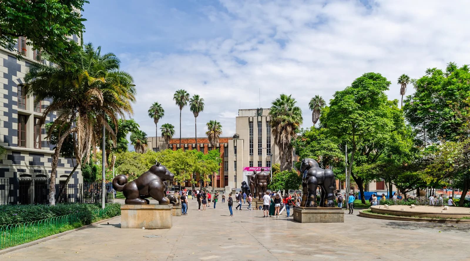 Bronze Botero sculptures and crowds in Plaza Botero with the Museo de Antioquia behind, Medellín