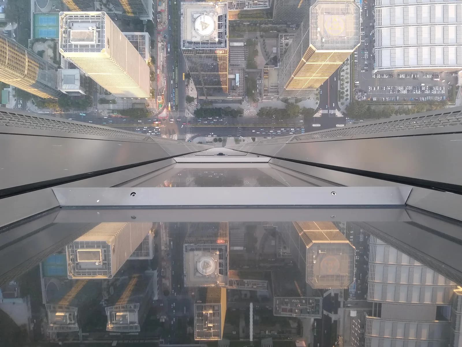 Visitors at the floor-to-ceiling windows of the Free Sky observation deck on the 116th floor of the Ping An Finance Center, Shenzhen