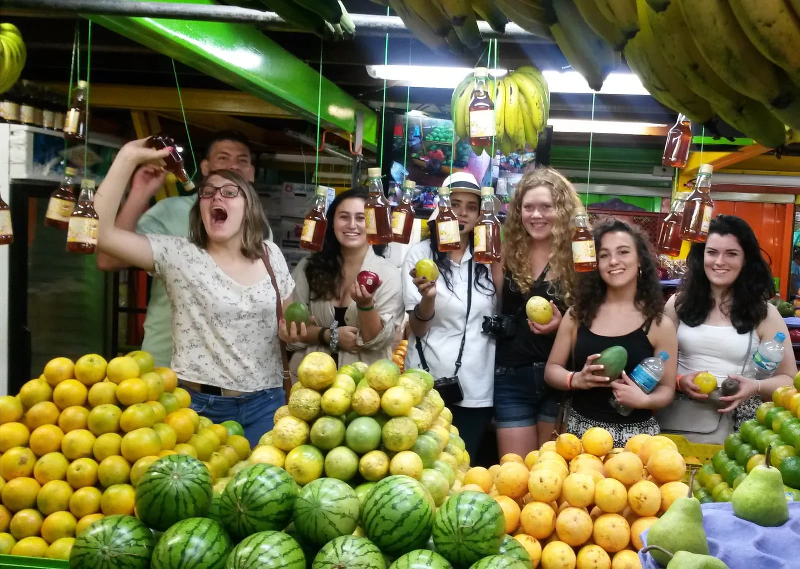 Produce stalls stacked with fruit and vegetables inside the Plaza Minorista market hall in Medellín, Colombia