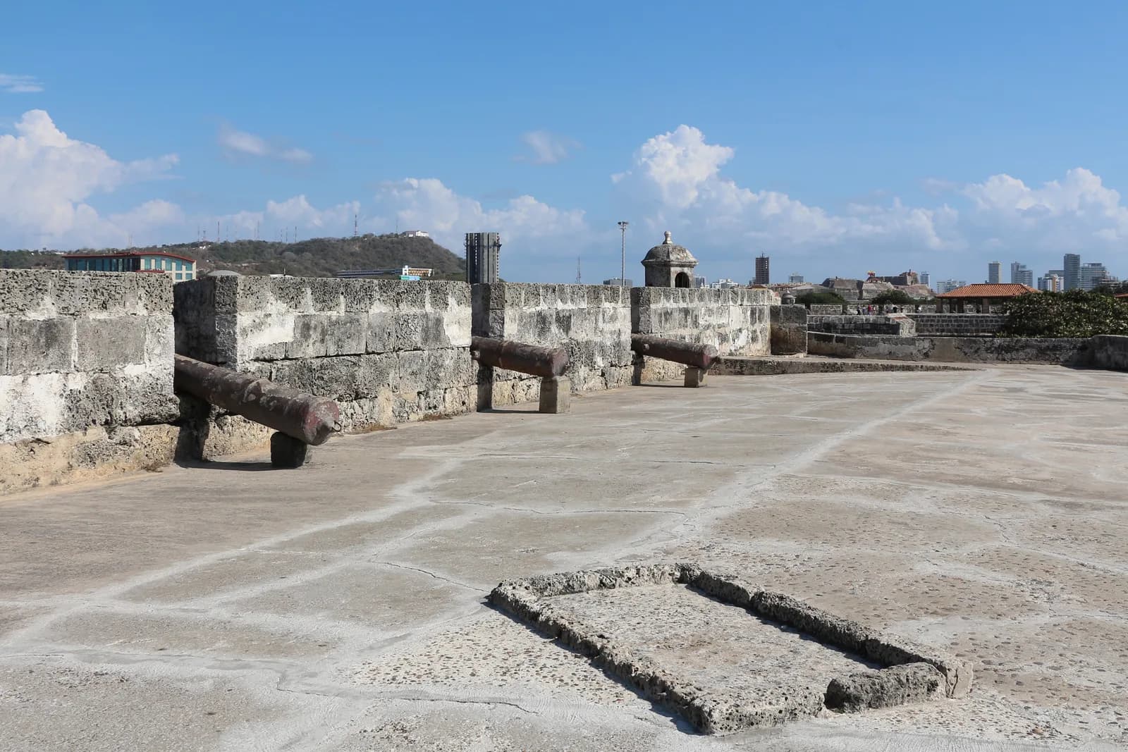 The stone city walls of Cartagena with a bartizan turret overlooking the Caribbean Sea