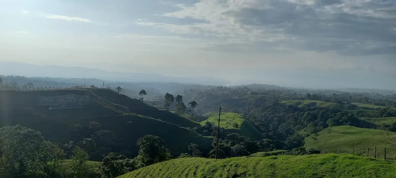 Panoramic view over green Quindio hills from the mirador above Filandia, Colombia